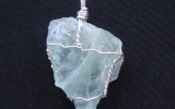 Raw aquamarine crystal pendant wire wrapped in sterling silver