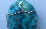 Chrysocolla pendant wire wrapped in sterling silver