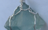 Raw fluorite octahedron crystal pendant wire wrapped in sterling silver