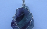 Raw fluorite crystal pendant wire wrapped in sterling silver