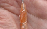 Tangerine calcite pendant wire wrapped in sterling silver