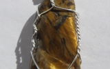 Tiger eye stone pendant wire wrapped in sterling silver